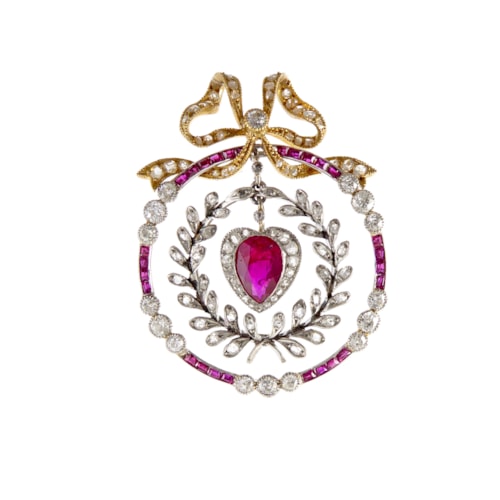 Early 20th century ruby and diamond heart and circle garland pendant, c.1910, with central pear shaped ruby and diamond heart, the facetted ruby of approximately 0.85ct,
